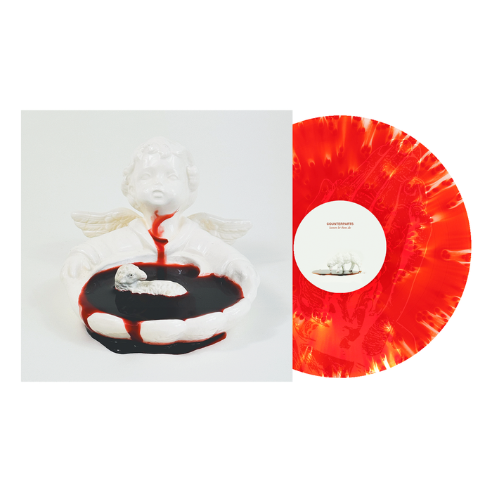 A cloudy blood red and white marbled vinyl from Counterparts’ 2nd press sits beside an album cover featuring a white cherub statue, a black pool with red liquid spilling over, and a small lamb resting in the center.