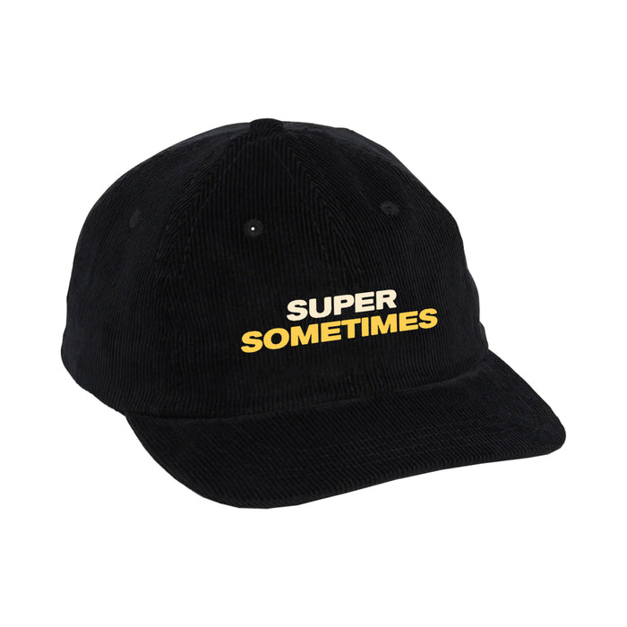 This black cotton corduroy cap by Super Sometimes features bold yellow and white SUPER SOMETIMES text embroidered on the front.