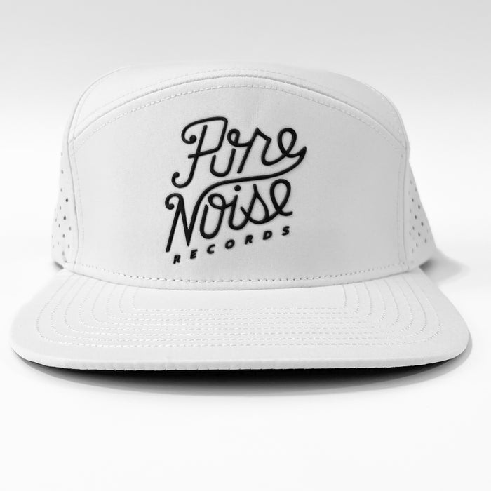 A white Pure Noise Records Merch baseball cap with perforated side panels and “Pure Noise Records” in black script on the front, displayed against a plain white background.