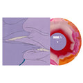 A marbled red, orange, and white vinyl record by Drug Church is partially pulled from a purple album cover with minimalist line art of two faces about to kiss.