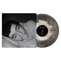 Side A of Sad Parks "Sleep" Vinyl LP with vinyl exposed to show color. color of vinyl is Black and White galaxy mix. Album Art is a man asleep with 3 cigarettes in his mouth.