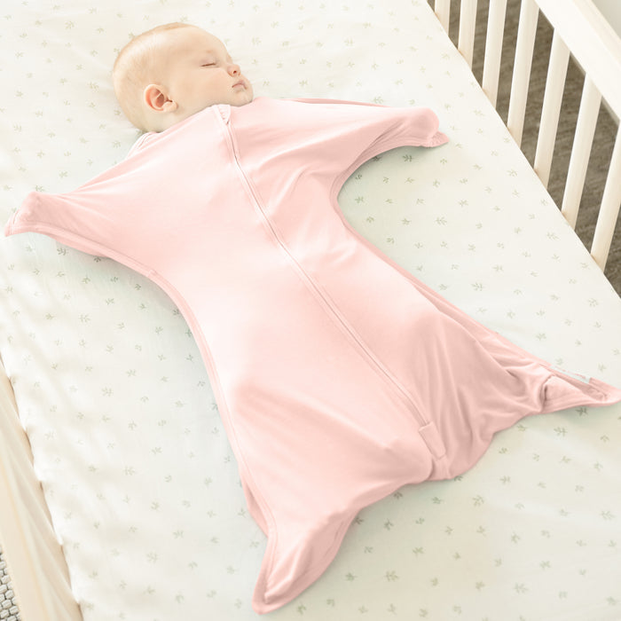 Baby wearing Dusty Rose bamboo Zipadee-Zip swaddle